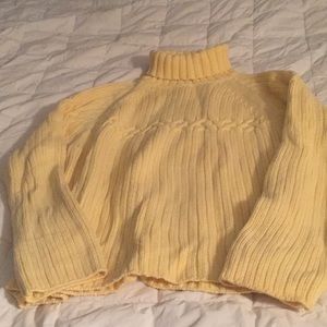 Yellow turtleneck sweater
